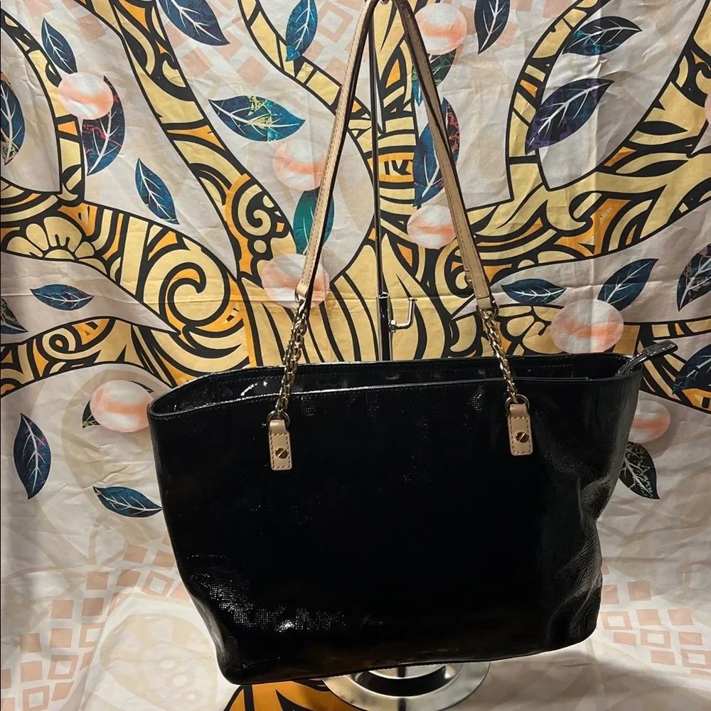 Michael Kors Jet Set Chain Tote in black patent leather with gold hardware.
